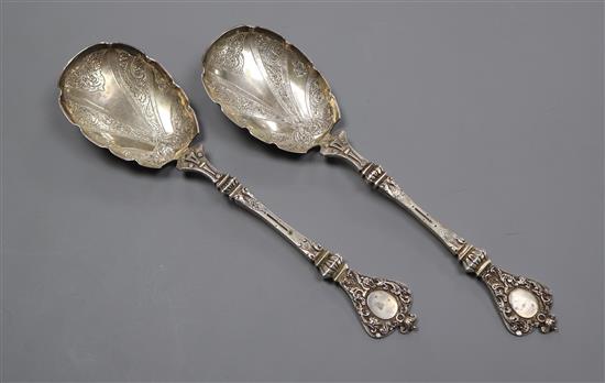 A pair of Victorian ornate silver serving spoons, by Charles Edwards, London, 1880, 7 oz.